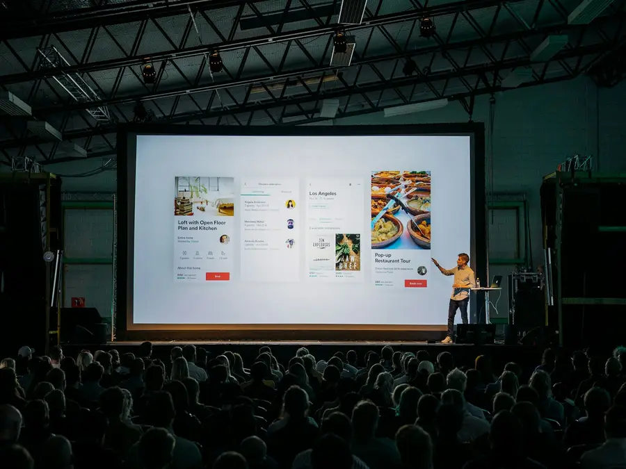 Speaker presenting on a conference stage